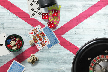 Jersey casino theme. Aces in poker game, cards and chips on red table with national wooden flag background. Gambling and betting.