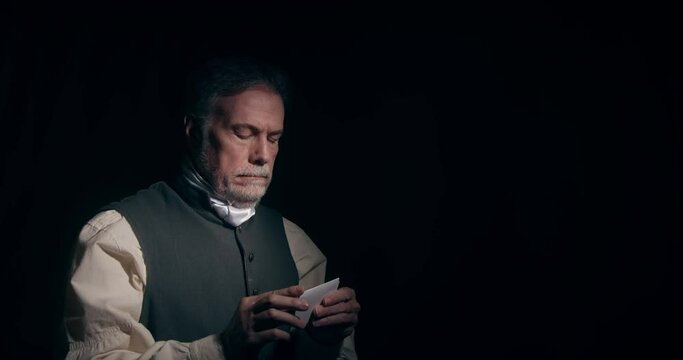 A dramatically lit scene of a mature gentleman of the American Revolutionary era opening a letter sealed with a wax seal customary of the age.