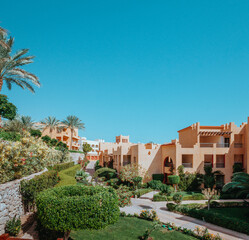 Unidentifiable Upscale Vacation Retreat in Egypt: Sun-Drenched Villa Amidst Verdant Tropical...