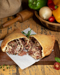 Fogazza stuffed with shredded meat and cheese