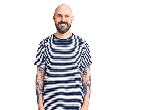 Young handsome man wearing casual clothes with a happy and cool smile on face. lucky person.