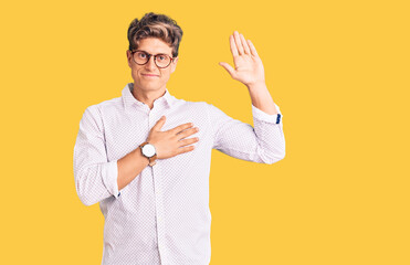 Young handsome man wearing business clothes and glasses swearing with hand on chest and open palm,...