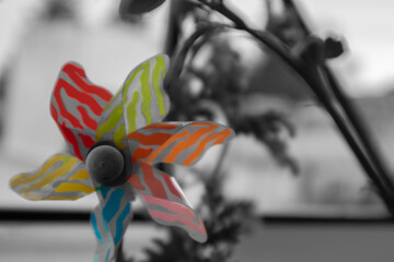 wind propeller toy rainbow color black and white background