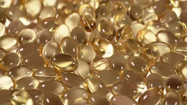 Fish Oil Supplement Gel Capsules, Omega-6 and Omega-3 Vitamins, macro footage, Health Care and Medical concept