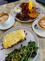 croque monsieur and coffee on table in french cafe with food