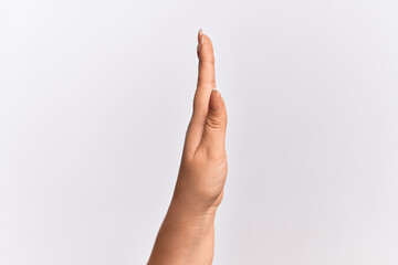 Hand of caucasian young woman showing side of stretched hand, pushing and doing stop gesture
