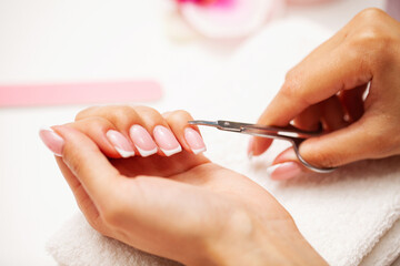Obraz na płótnie Canvas Woman close up of doing manicure on hands