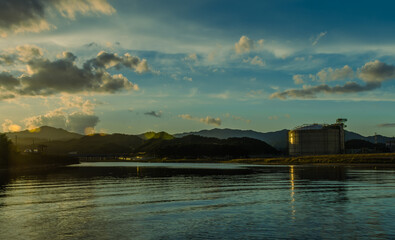 Gasoline storage tank on coastal water inlet.