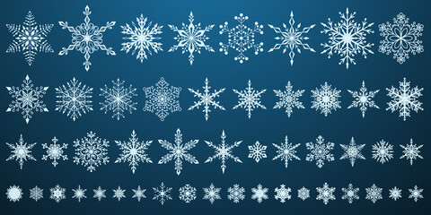 Set of beautiful complex Christmas snowflakes, white on blue background