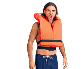 Young handsome man wearing nautical lifejacket winking looking at the camera with sexy expression,...