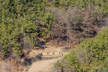 Two burial mounds on mountainside