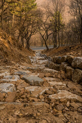 Drainage ditch constructed of large boulders