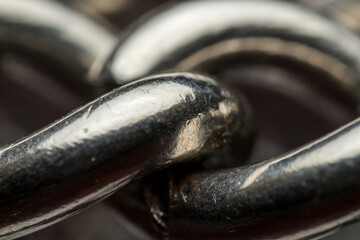 vintage galvanized steel chain for wearing watches close-up, macro of unity of rings of one chain,...