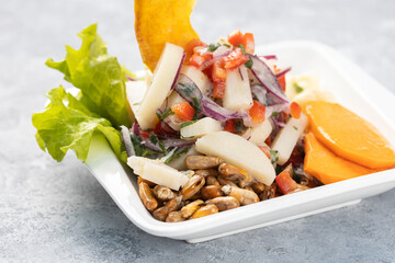 Vegetable ceviche with palmetto, onion, carrot, served with cancha serrana and crispy plantain,...