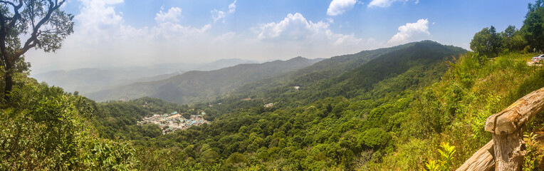 Panorama view of Doi Pui’s Hmong ethnic hill-tribe village, aerial view green forest on the mountain background. Doi Pui Hmong tribal village is located on Doi Suthep-Pui national park, Chiang Mai.
