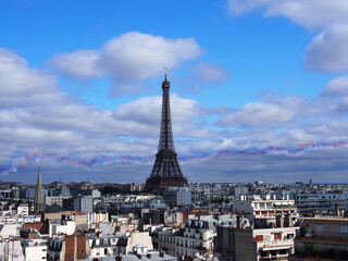 Celebrating Bastille Day Air Force and Army demonstration flight in Paris sky.