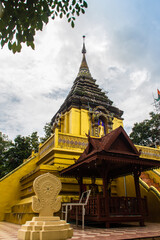 Fototapeta na wymiar Beautiful golden Buddhist pagoda at Wat Phra That Doi Prabat (Wat Doi Phra Baht). Doi Phrabat Temple is the location of important historical sites and ancient religious in Chiang Rai, Thailand.