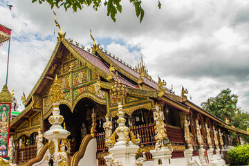 Fototapeta premium Beautiful art, religious places and religious objects in Myanmar mixed with Lanna style at Wat Ming Muang Buddhist temple, Chiang Rai, Thailand. Mixed Lanna and Burmese arts.