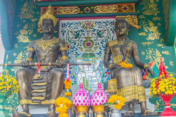 King Mangrai and his queen statues at Wat Ming Muang Buddhist temple, Chiang Rai, Thailand. King Mangrai, also known as Mengrai. He founded the city of Chiang Rai as his new capital of Lanna in 1262.