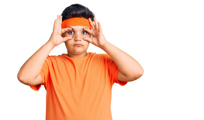 Little boy kid wearing sportswear trying to open eyes with fingers, sleepy and tired for morning...