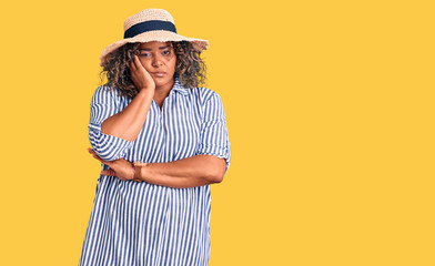 Young african american plus size woman wearing summer hat thinking looking tired and bored with depression problems with crossed arms.
