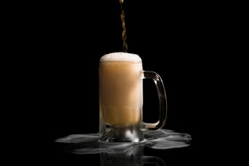 Refreshing, frothy stream of beer, filling a glass mug, beer spilling from the jar to the base, on a black background, celebration of the International Beer Festival.