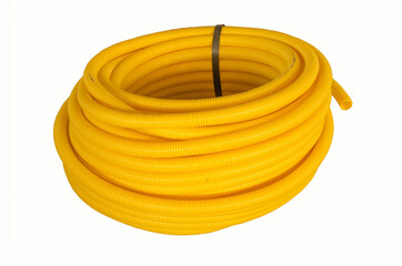 Yellow corrugated polyvinylchloride pipe whorl on white background