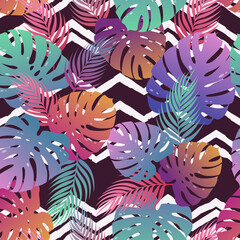 Fototapeta na wymiar Tropical vector seamless pattern with colorful exotic monstera and palm leaves on geometrical background. Botanical design template for print, fabric, invitation, brochure, card, cover, wallpaper