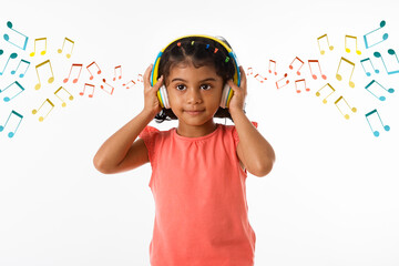 Music, childhood and technology concept- little indian girl with headphones over white backgroundound with musical notes