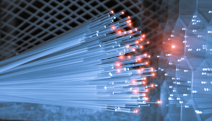 Fiber optics network cable on technology background