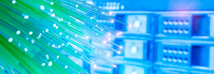 Fiber optics network cable on technology background
