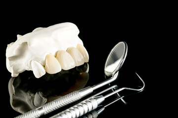 Fototapeta na wymiar Closeup / Prosthodontics or Prosthetic / Tooth crown and bridge implant dentistry equipment and model express fix restoration.