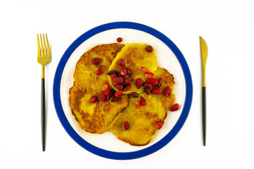 Plate of fried pancakes or fritters with fruit