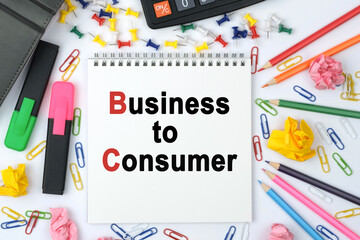 On the table is a calculator, diary, markers, pencils and a notebook with the inscription - Business to Consumer
