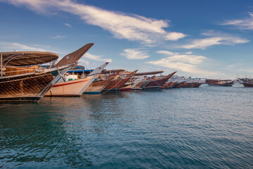 Dhow boat on wakra port at sunset time - obrazy, fototapety, plakaty