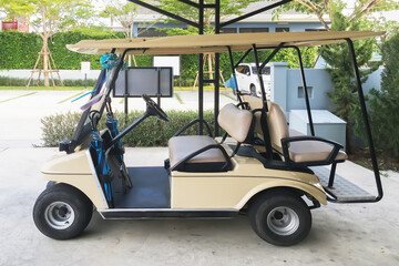 Golf cart electrical car in parking garage office waiting for transportation service on tropical warm holiday season.
