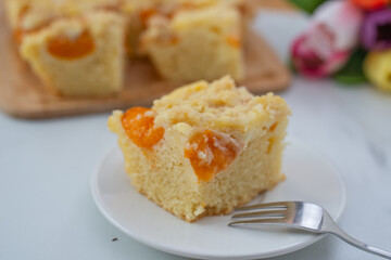 home made german apricot streusel cake on a table