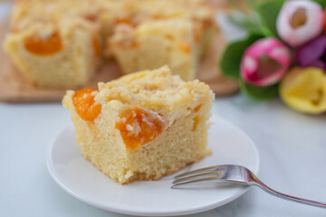 home made german apricot streusel cake on a table