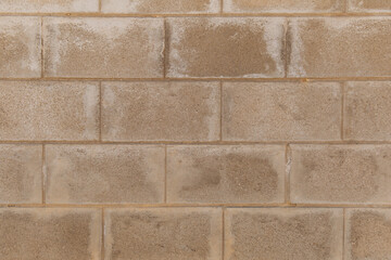 Weathered stained brown brick wall. Textured. Background