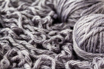 Thick dense woolen threads gray color for knitting. Wool balls. Top view.