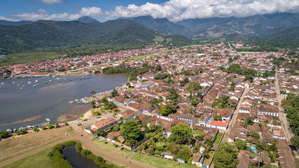 Fototapeta na wymiar Aerial view to historic town Paraty and harbour, green mountains in background, sunny day, Unesco World Heritage, Brazil 