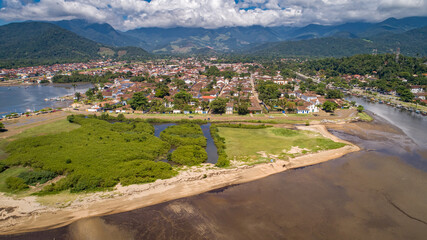 Fototapeta na wymiar Close up aerial view to historic town Paraty with green mountains in background on a sunny day, Brazil, Unesco World Heritage 