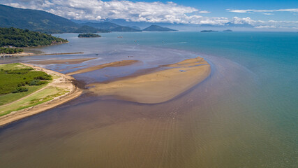Aerial view from Paraty along Green Coast with turquoise water, sandbanks and green mountains at low tide, Brazil
