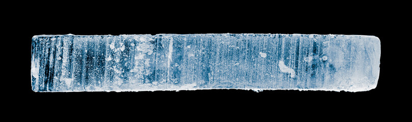 narrow ice block, with rime, isolated on black background. Clipping path included.