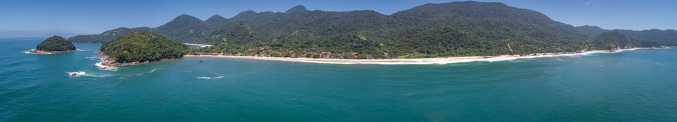 Fototapeta premium Aerial view panorama to wonderful Green Coast shoreline and mountains covered with Atlantic Forest, Picinguaba, Brazil