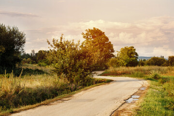 Fototapeta na wymiar Rural landscape with curve country asphalt road
