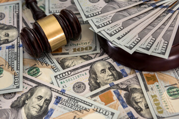 justice gavel on dollar banknotes