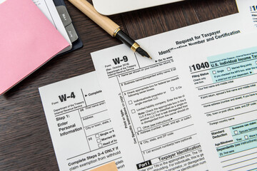 1040 tax form with pen, finance document