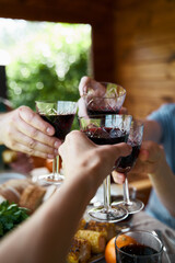 Hands with drinks in glasses celebrate party countryside