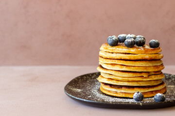 Pancakes with blueberries and honey. Breakfast. Vegetarian food. Recipe.